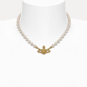 Vivienne Westwood Pearl brass relief choker necklace